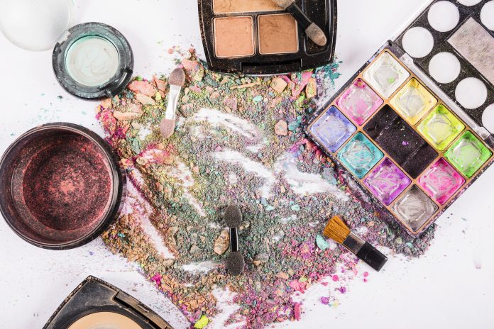 high-angle-view-colorful-cosmetic-powders-white-surface